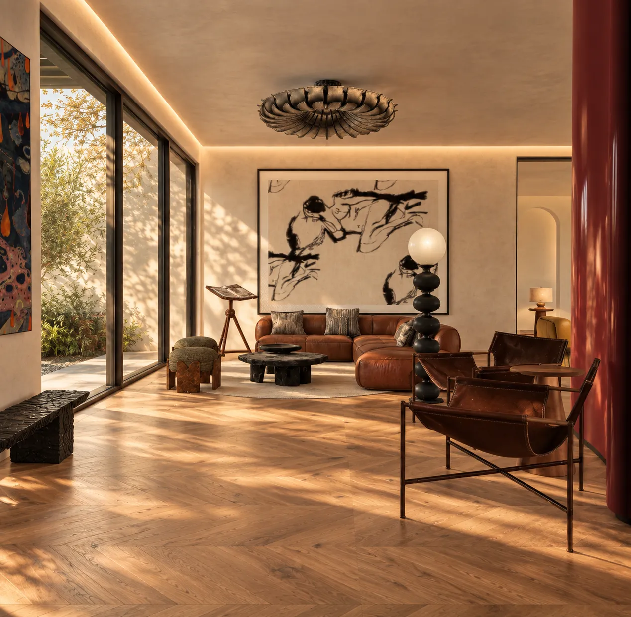 Garden-facing windows with butterfly leather chairs and a sculptural black bench in golden light