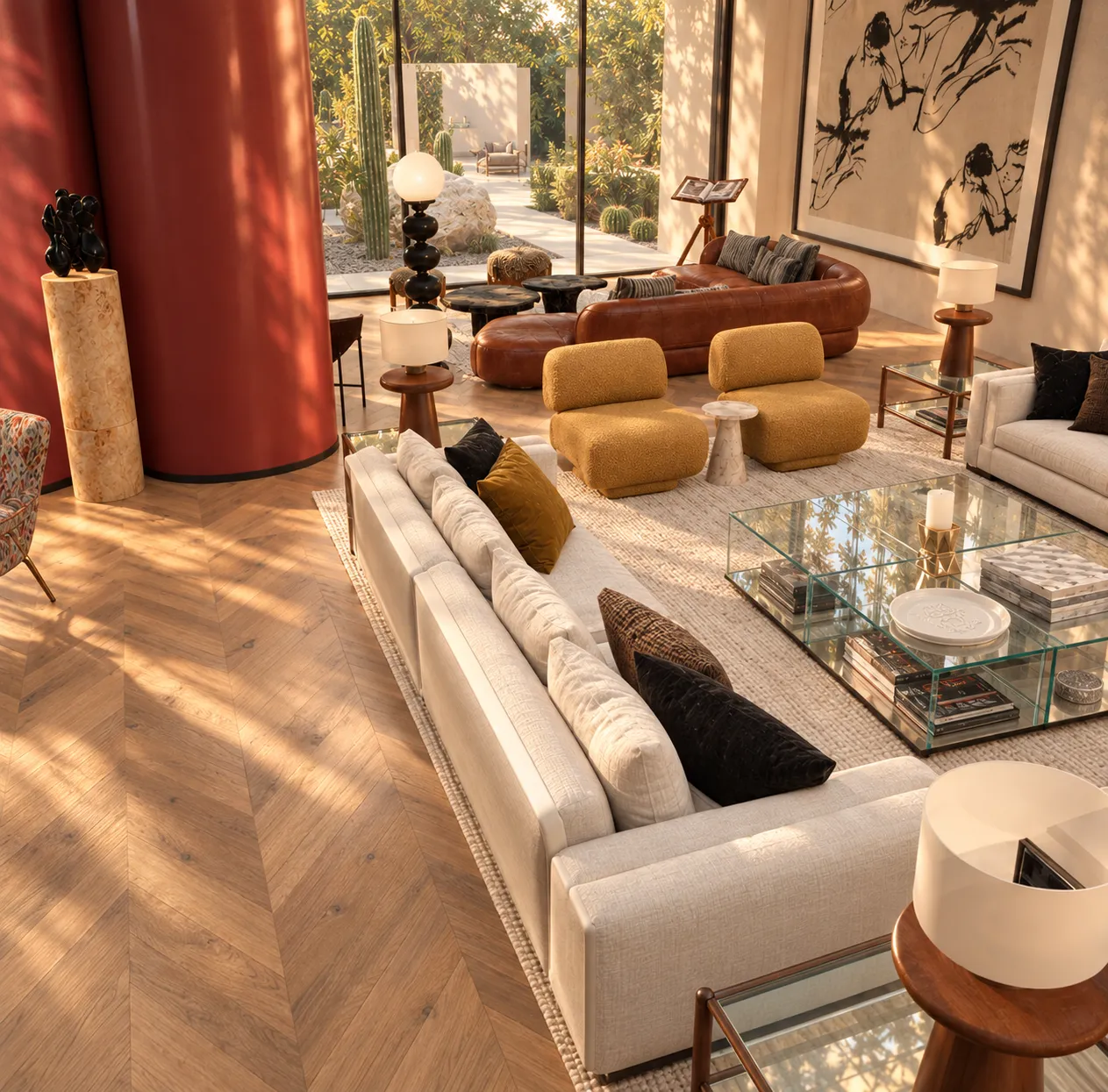 View across the living area from the long pale sofa, with mustard chairs, glass tables and a burgundy column